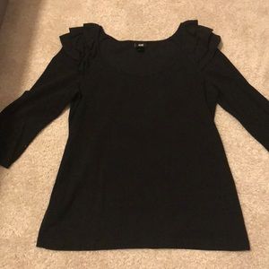 Black shirt with ruffle shoulder